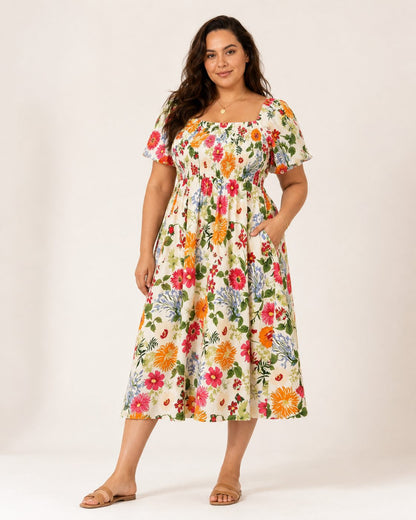 Elena Kleid – Sommerkleid aus Baumwolle mit Blumenmuster, eckigem Ausschnitt und Taschen